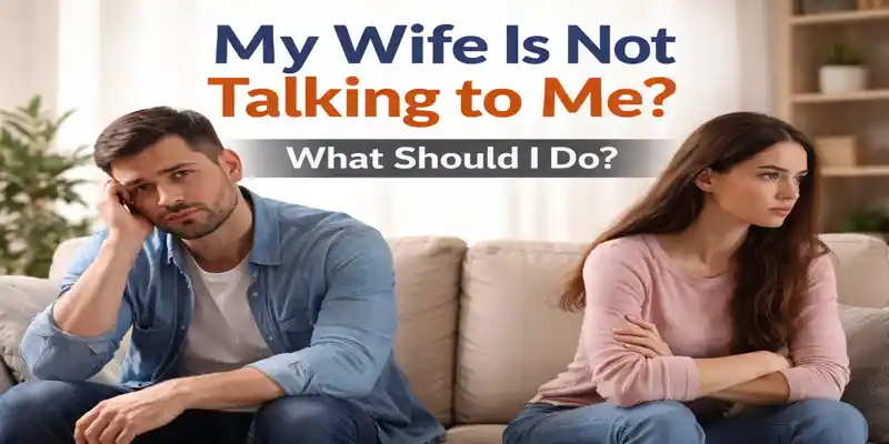 Couple sitting apart after an argument, showing relationship communication problems